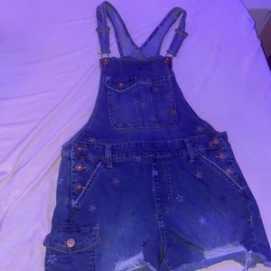 Overalls with gold and grey stars . Denim blue .